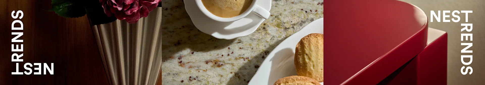 Φλιτζάνι καφέ, μπισκότα madeleine, τριαντάφυλλο σε βάζο, σε πάγκο δίπλα σε κόκκινο κουτί με 'NEST TRENDS'.